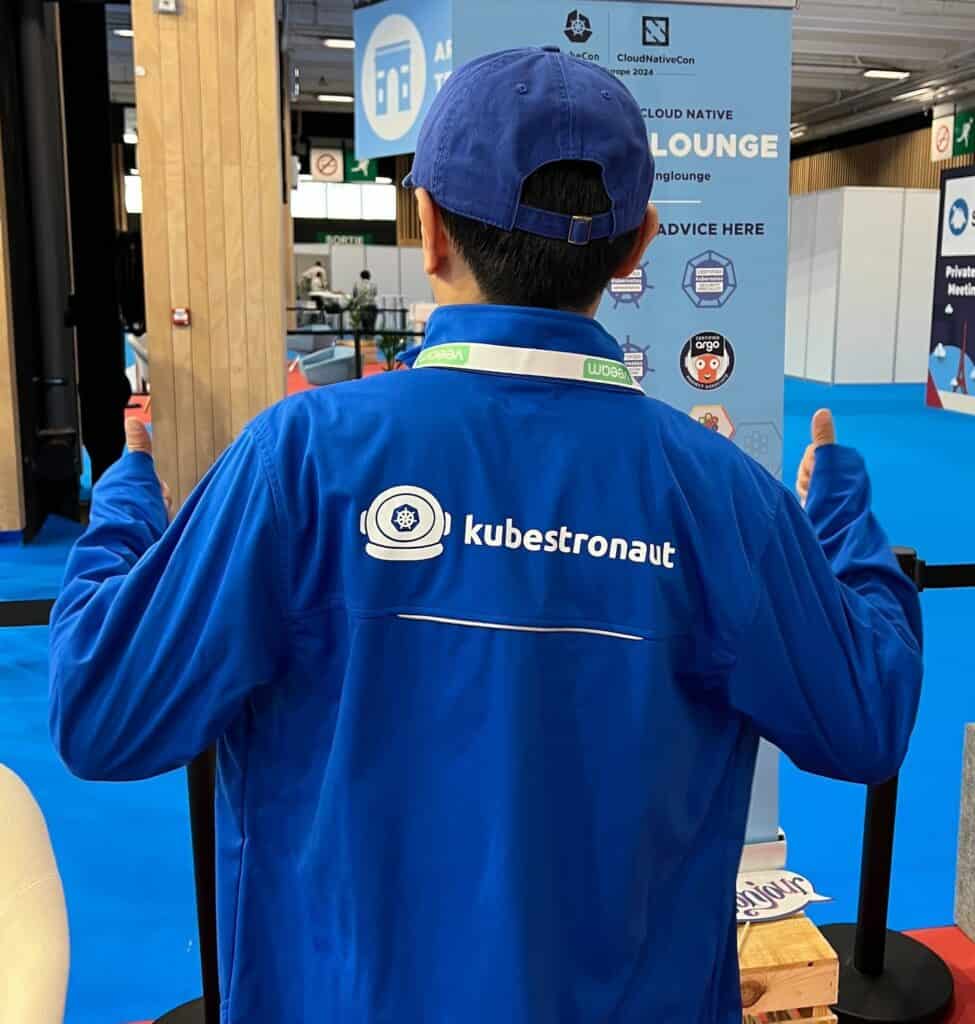 Man showing the back of the Kubestronaut jacket