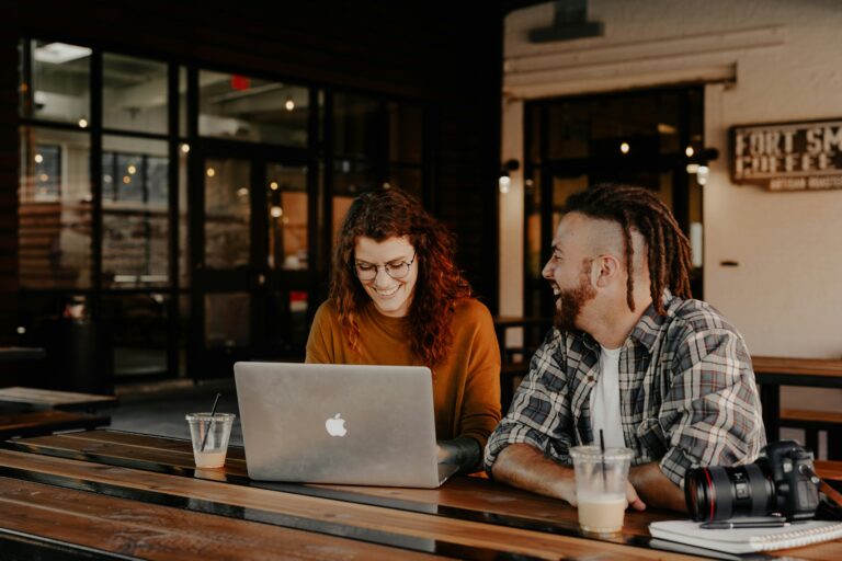 Event organizers working from laptop