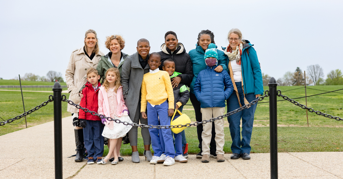 Families posing in front of the Washington Monument