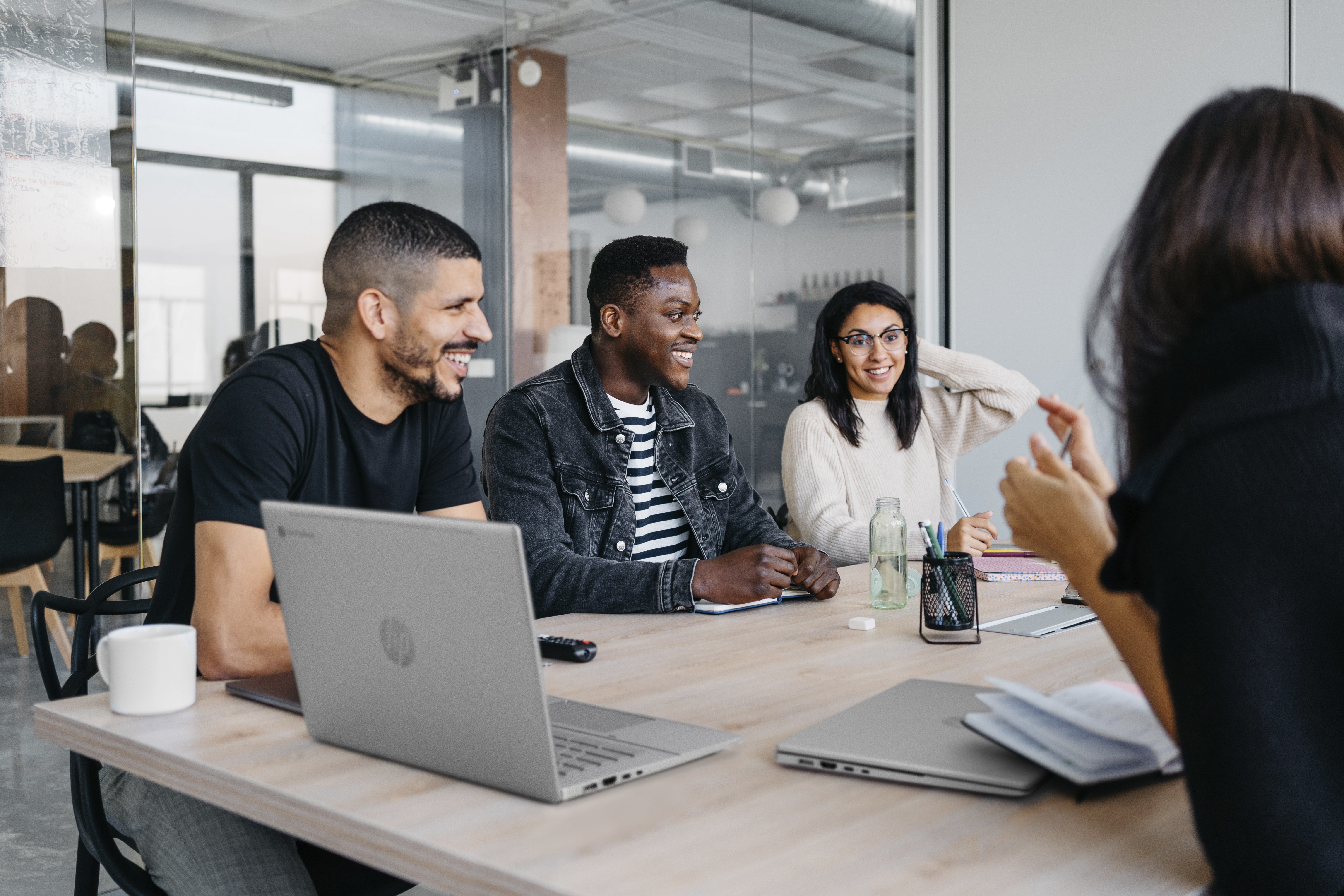 Group of office workers across a conference table