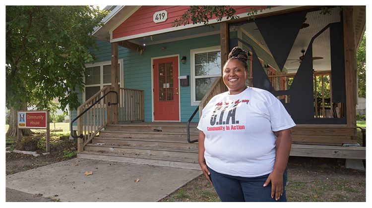 Tina stands in front of the completed community center in Lafayette.