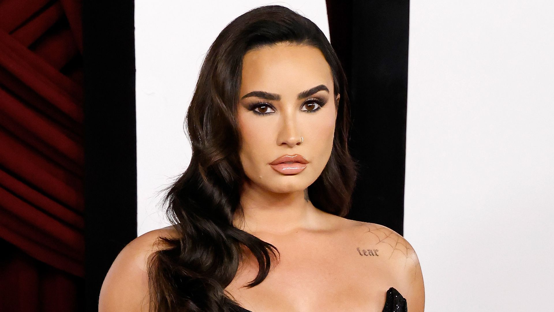 Demi Lovato wears black corset and sheer tights in latest outing with her fiancé Jutes