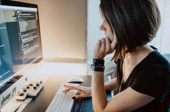 woman reading computer screen