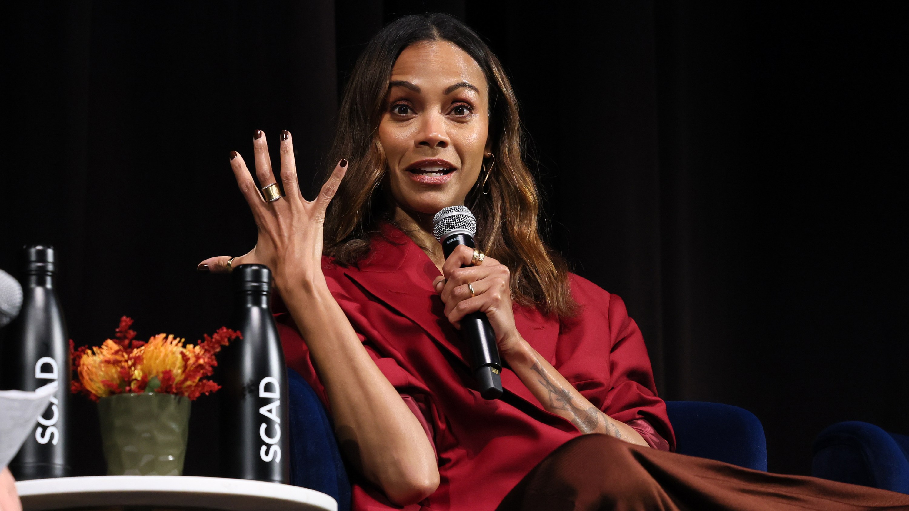 SAVANNAH, GEORGIA - NOVEMBER 01: Zoe Saldaña speaks onstage at the "Emilia Pérez" Q&A during the 27th SCAD Savannah Film Festival at Trustees Theater on November 01, 2024 in Savannah, Georgia. (Photo by Dia Dipasupil/Getty Images for SCAD)