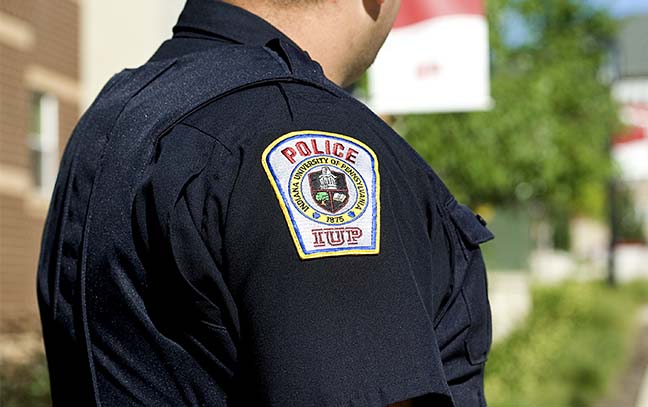 close up shot of police patch on the shoulder of an officer