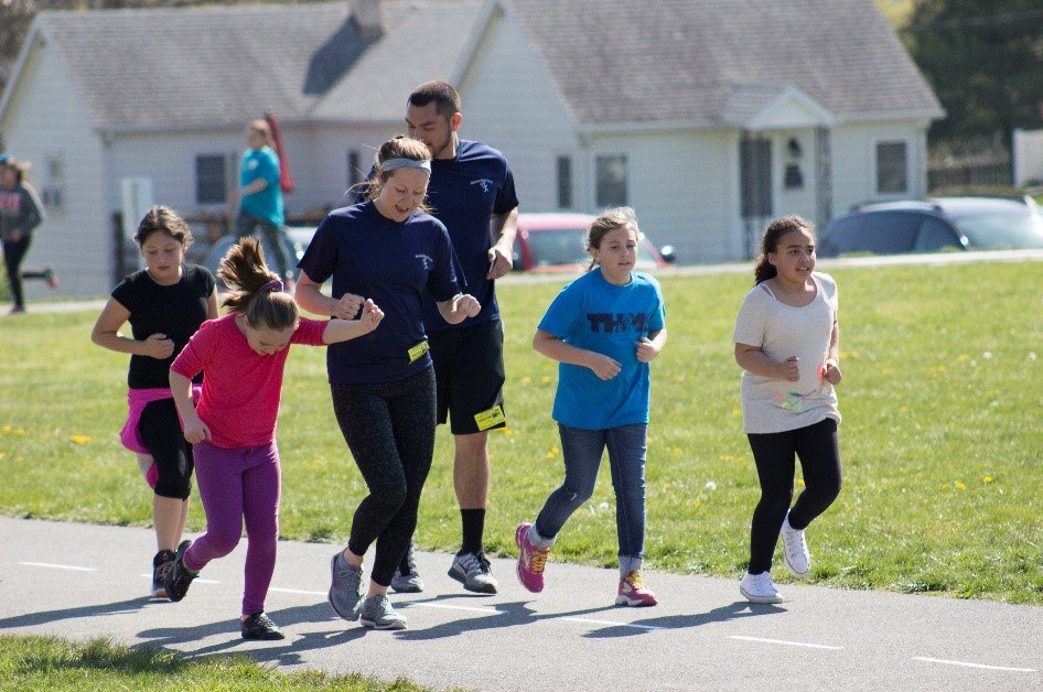 Girls have HEART staff and participants run together