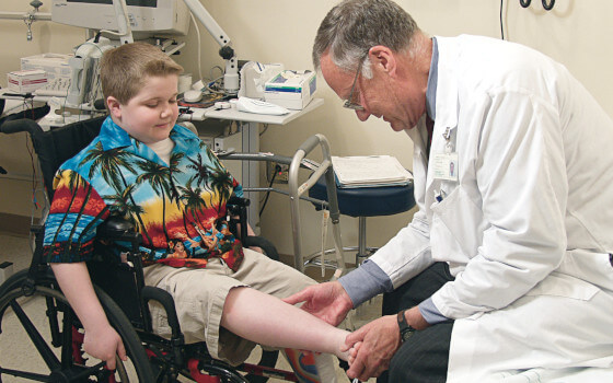 A photo of a little boy having a checkup at a doctor's office.