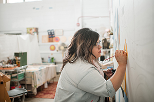 art student painting canvas