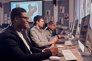 male students in computer lab classroom