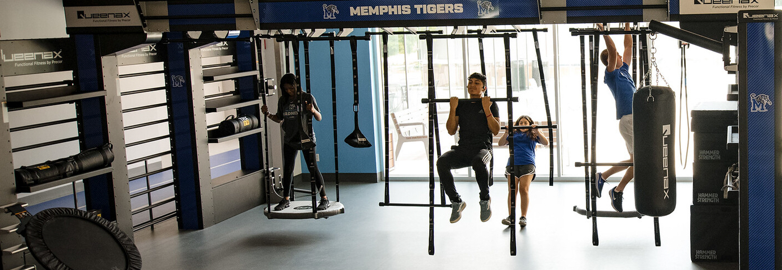 Students exercising with equipment.