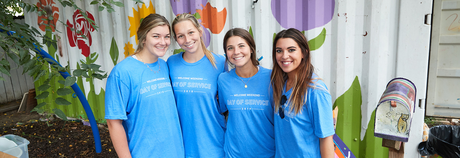 4 female students volunteering for Day of Service