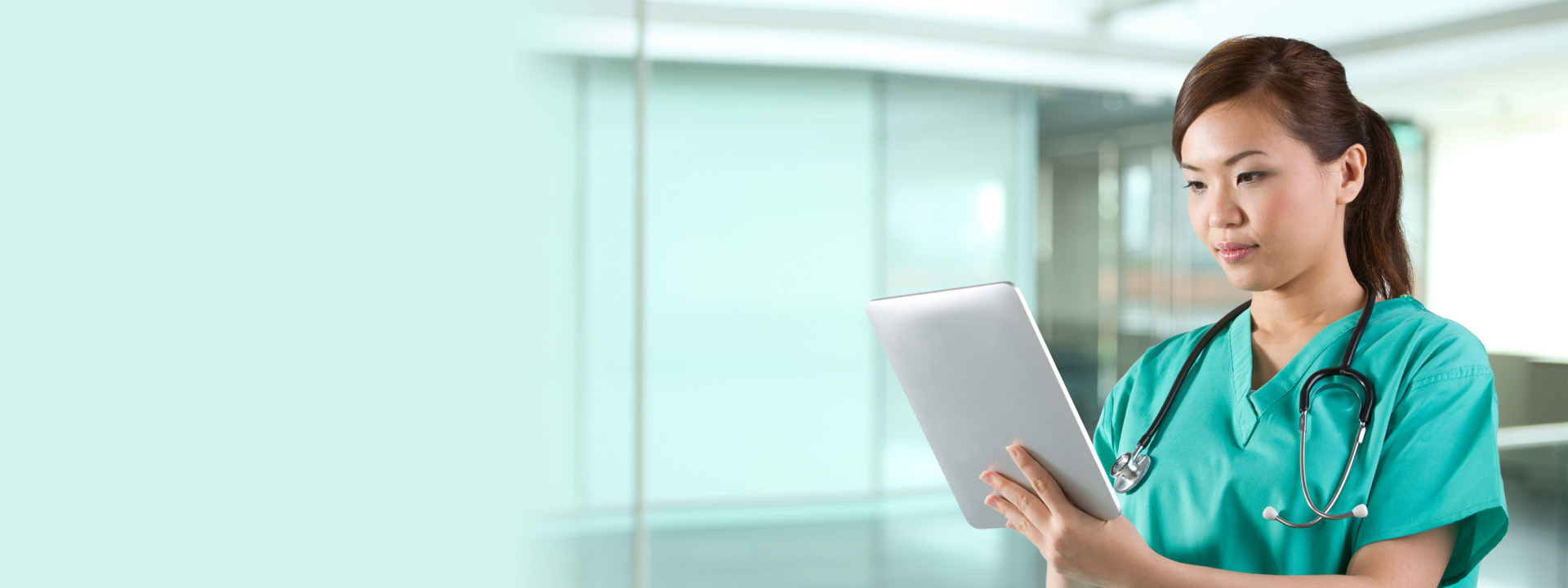 female doctor / nurse reviewing a tablet