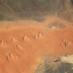 Windswept sand formations known as star dunes, or pyramid dunes, are a distinctive feature of the Sahara Desert in northern Africa.