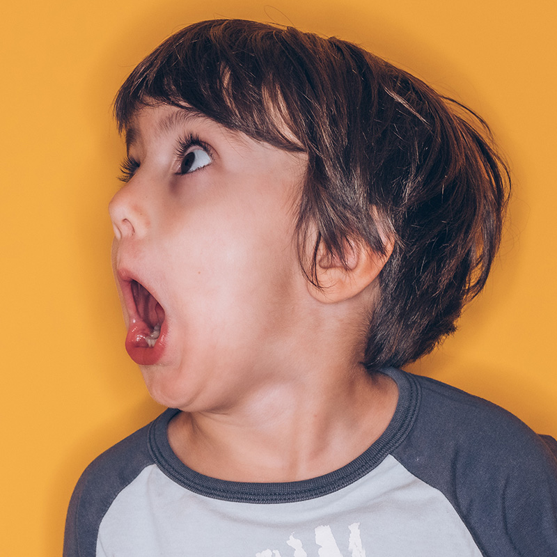 A young boy shocked at the skyrocketing results from his website after investing in professional copywriting and content writing