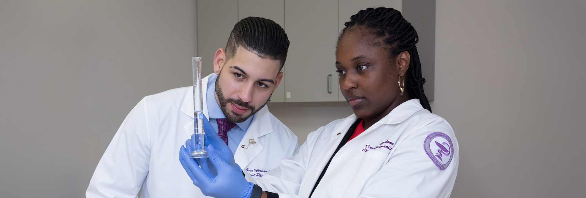 NSU pharmacy students working on lab