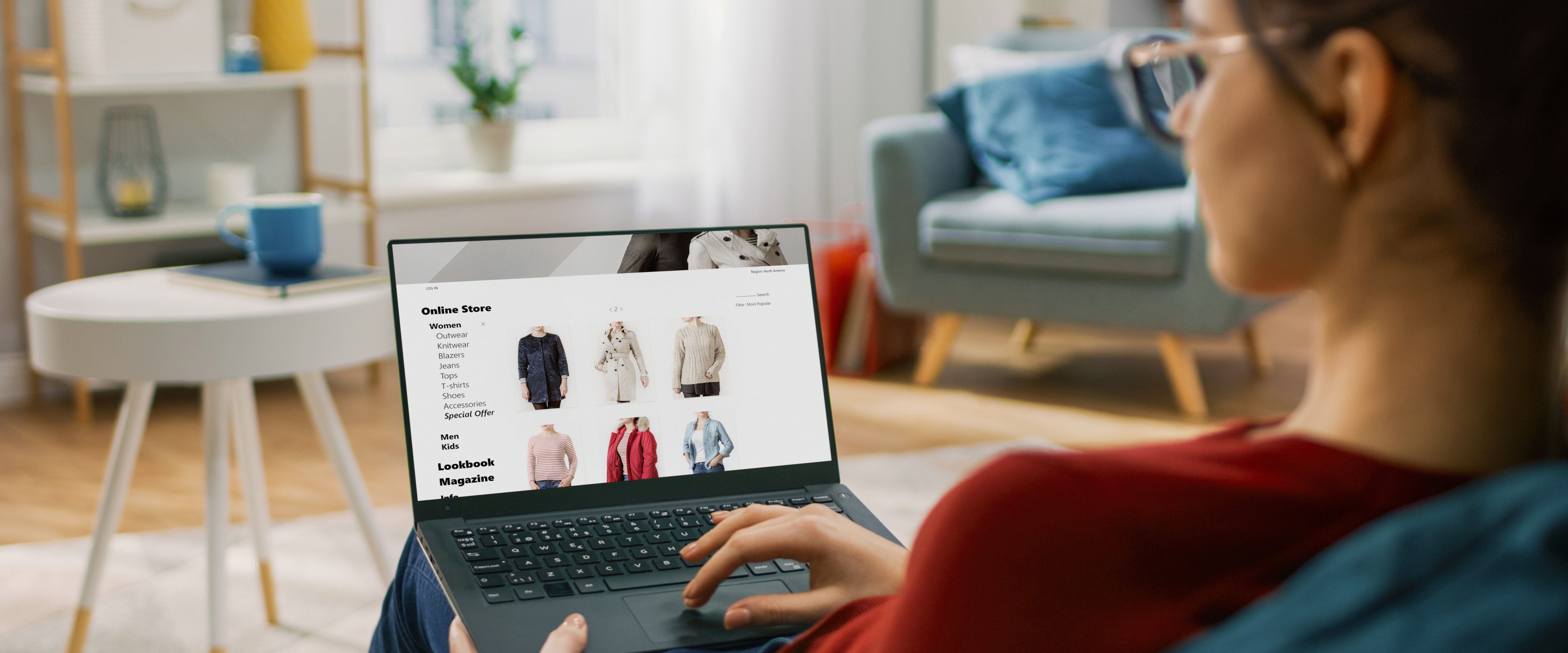 Image of young woman looking at an online shop on their laptop