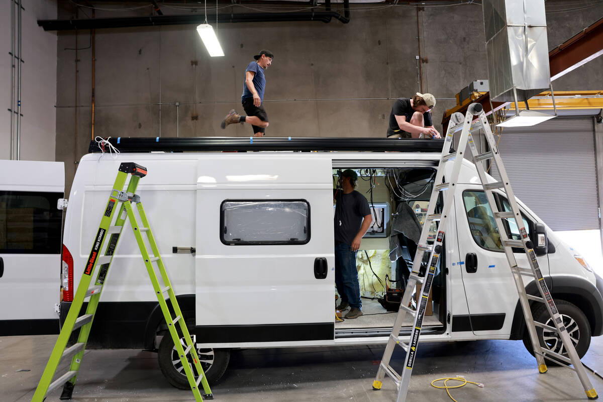 Workers convert a van into a mobile home at Noovo manufacturing facility in Las Vegas Thursday, ...