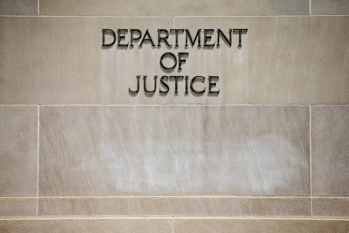 FILE - The Justice Department Building in Washington. (AP Photo/Andrew Harnik/File)