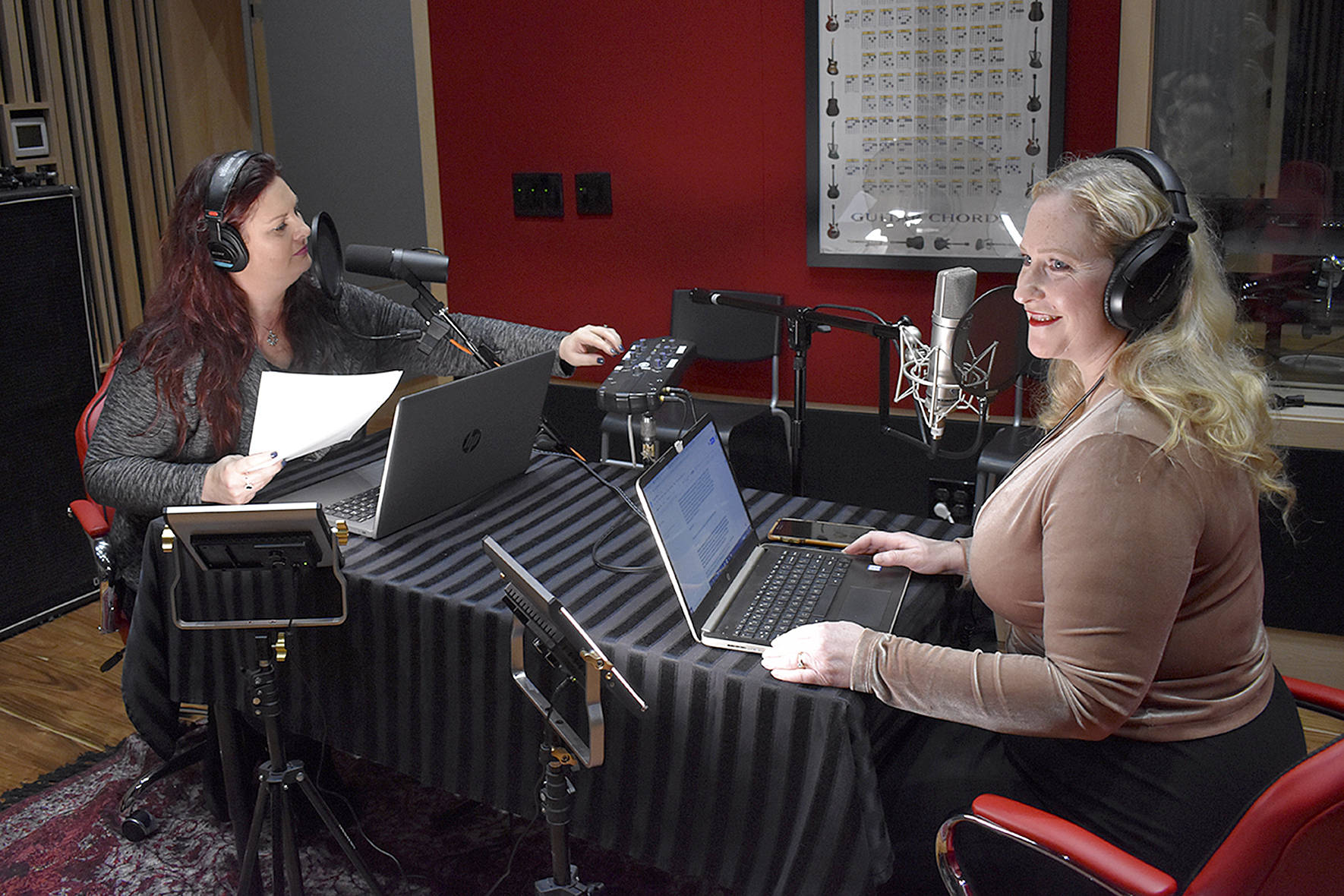 Photo by Haley Ausbun. Kim Shepard (left) and Carolyn Ossorio (right) launched a new true crime podcast, recorded at a sleek studio in Coal Creek. Ossorio is a former Renton Reporter columnist and both hosts previously worked at KIRO radio.