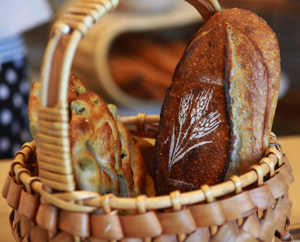 Rye flour and a stencil creates a beautiful pattern on breads at Goguette Bread in Santa Rosa. (John Burgess/The Press Democrat)