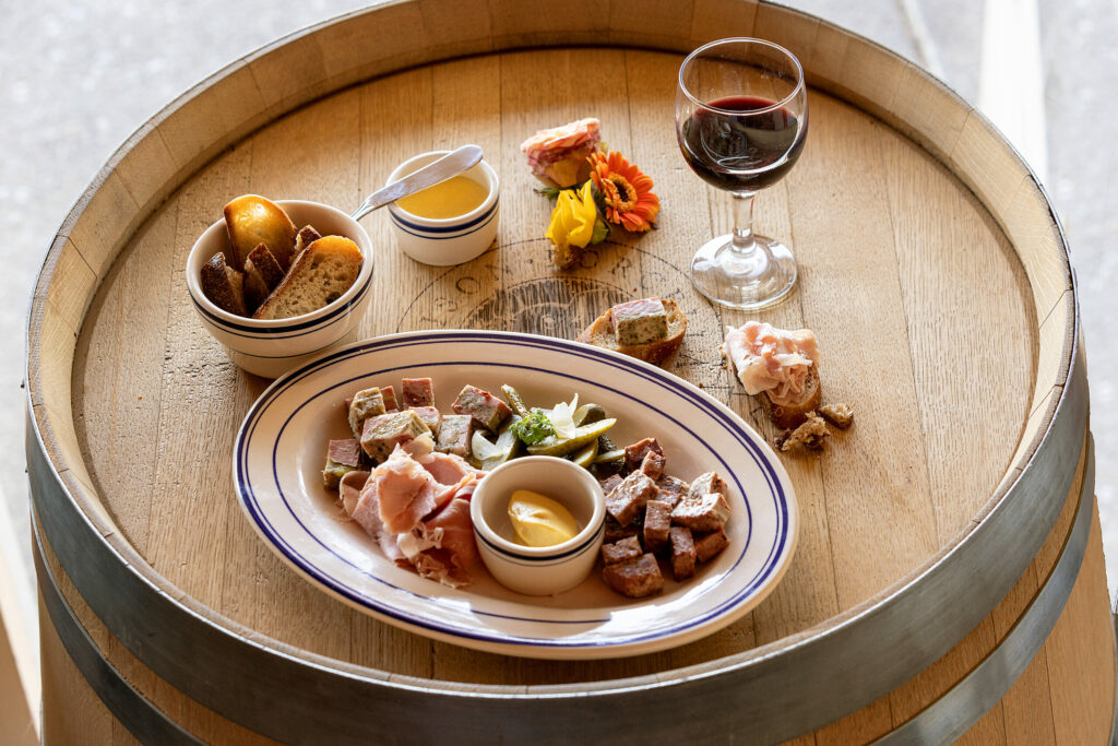 Charcuterie board with house-made assorted pates, French-style ham, cornichons and bread from Maison Porcella in Windsor. (John Burgess/The Press Democrat)