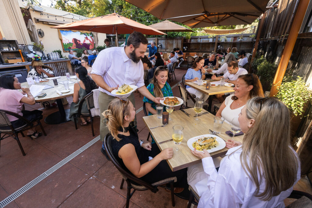 The popular patio at The Girl and The Fig on farmers market night in the Sonoma square Tuesday, July 9, 2024. (John Burgess/The Press Democrat)