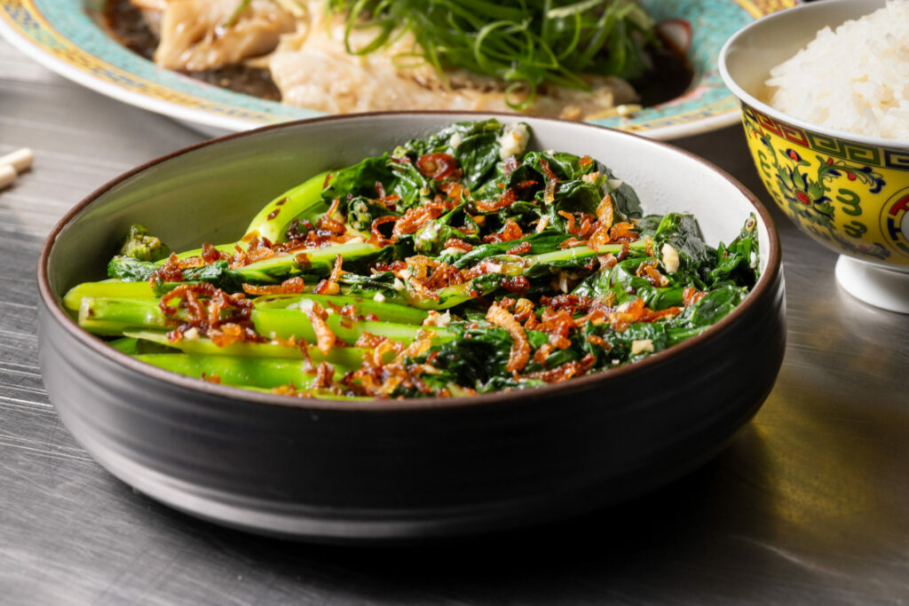 Gai Lan with garlic, sesame, char siu sauce and fried shallots from Bazaar Sonoma, BaSo | Restaurant & Konbini Oct. 17, 2024 in Forestville. (John Burgess / The Press Democrat)