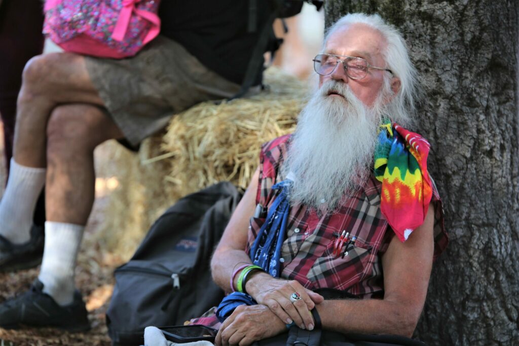 The shade of an old tree proves to be the perfect place to take a nap for this gentleman at the 45th Gravenstein Apple Fair at Ragle Ranch Park in Sebastopol, Sunday, Aug. 12, 2018. (Will Bucquoy/ for The Press Democrat)