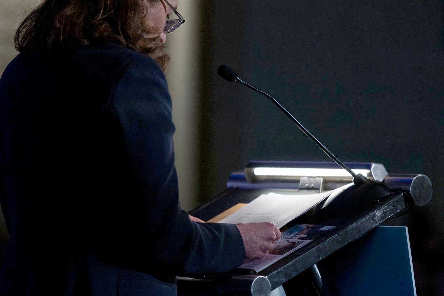 woman at speaker podium