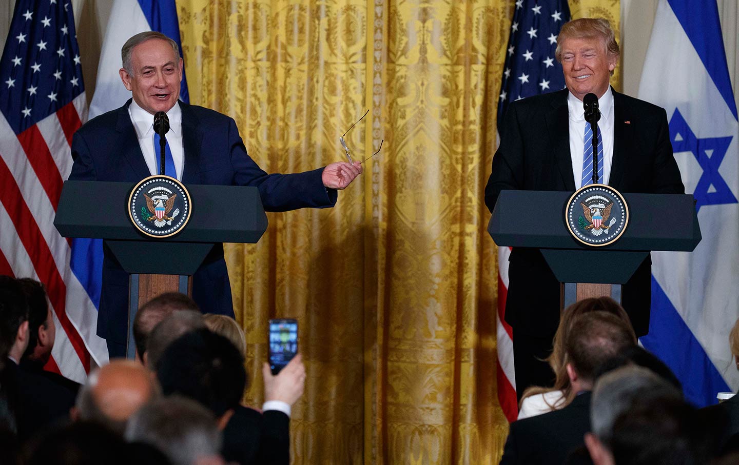 Donald Trump listens as Benjamin Netanyahu speaks during their joint news conference at the White House, February 15, 2017.