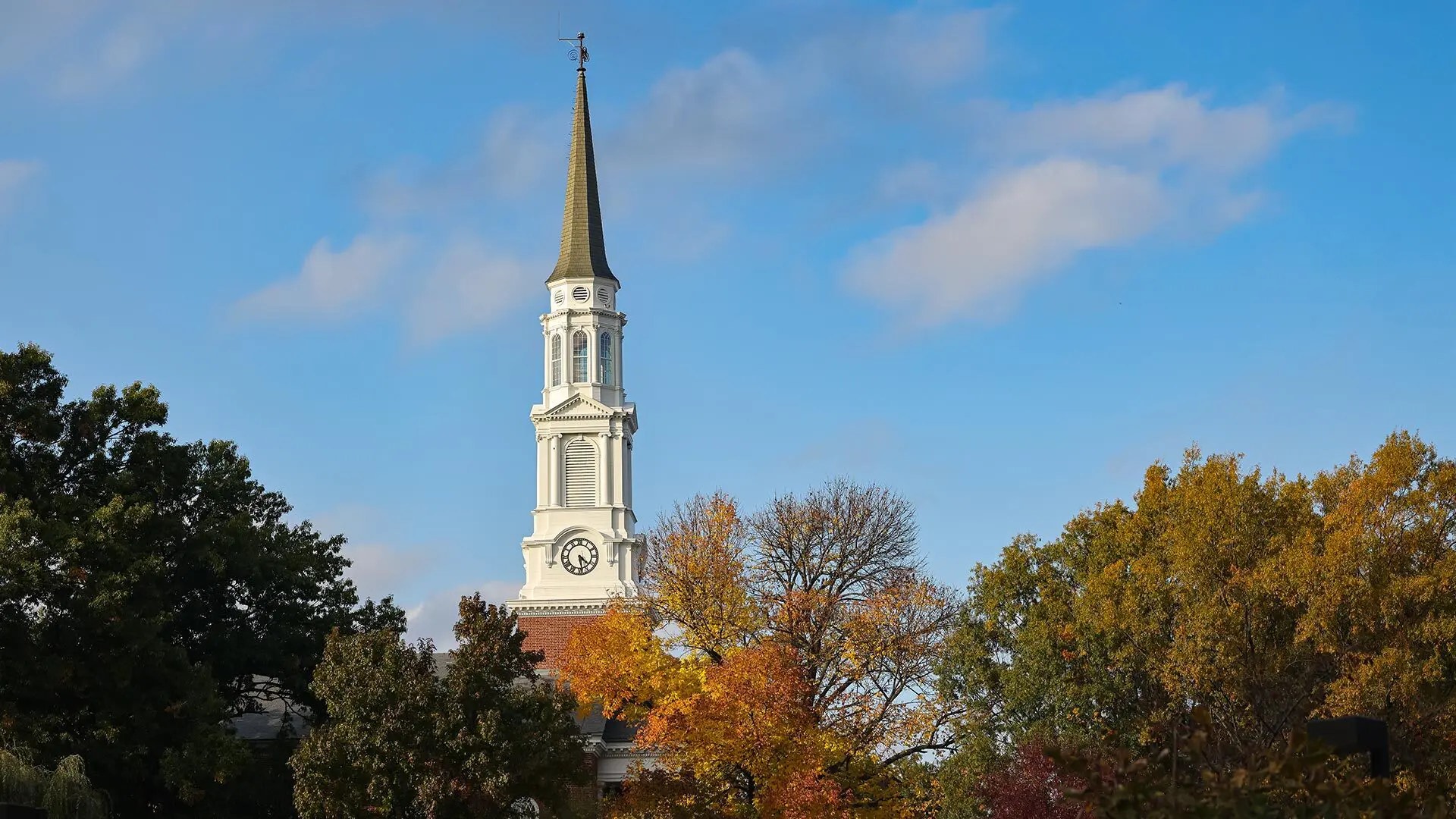 The top of the Memorial Chapel sticks out above the trees