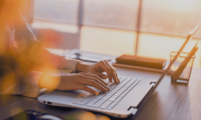 young woman working on laptop