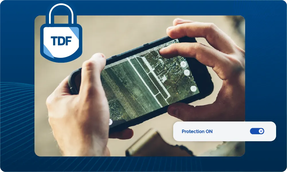 A military user views an aerial map on a mobile phone. TDF icon shows that the data is protected by Virtru TDF