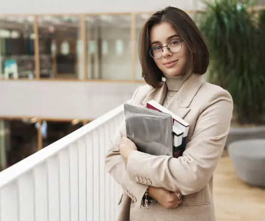 Student holding books.