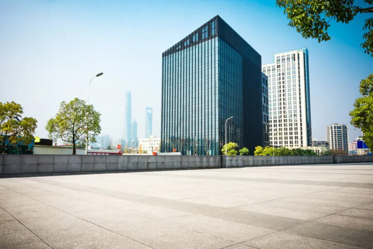 A large building with trees in front of it